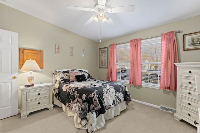 bedroom featuring light carpet and ceiling fan