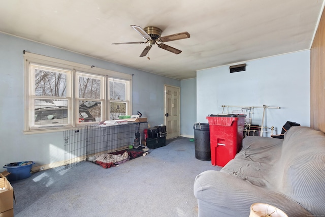 living room featuring carpet flooring and ceiling fan