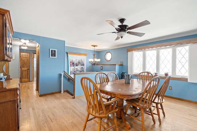 dining room featuring ceiling fan with notable chandelier, crown molding, and light hardwood / wood-style floors