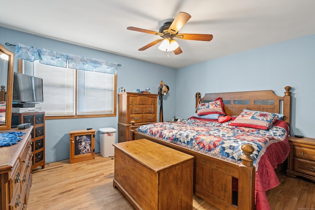 bedroom with ceiling fan and light hardwood / wood-style flooring