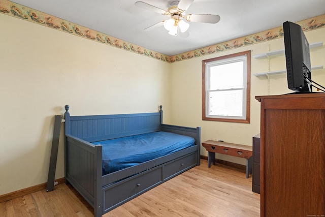 bedroom with ceiling fan and light hardwood / wood-style floors