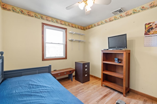 bedroom featuring ceiling fan and light hardwood / wood-style flooring