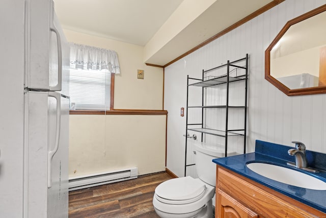 bathroom with toilet, baseboard heating, wood-type flooring, and vanity