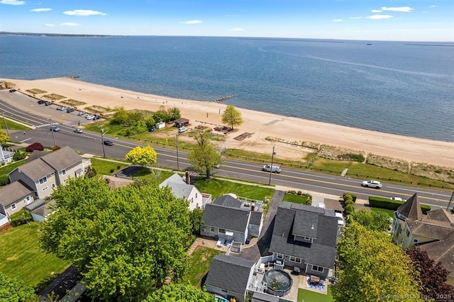 drone / aerial view with a view of the beach and a water view