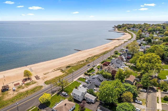 drone / aerial view featuring a view of the beach and a water view