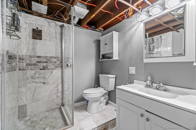 bathroom with a shower with shower door, vanity, and toilet