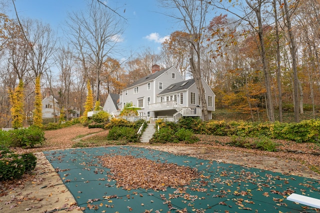 exterior space featuring a covered pool and a patio