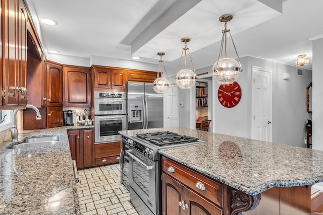 kitchen featuring stainless steel appliances, sink, hanging light fixtures, light stone countertops, and a center island