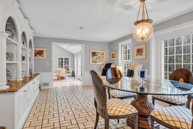 dining room featuring lofted ceiling