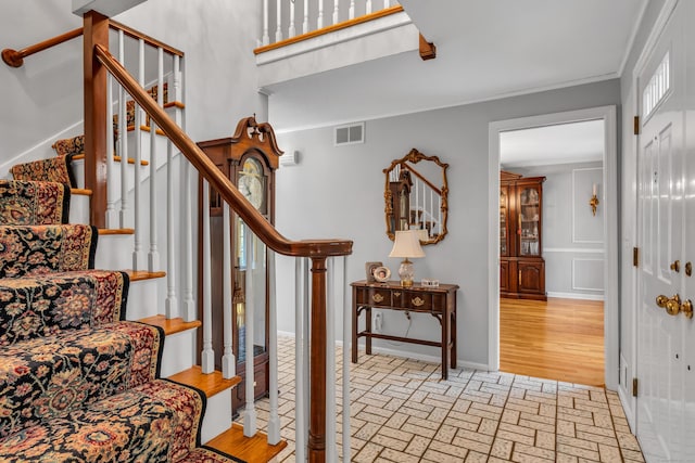 entryway with crown molding