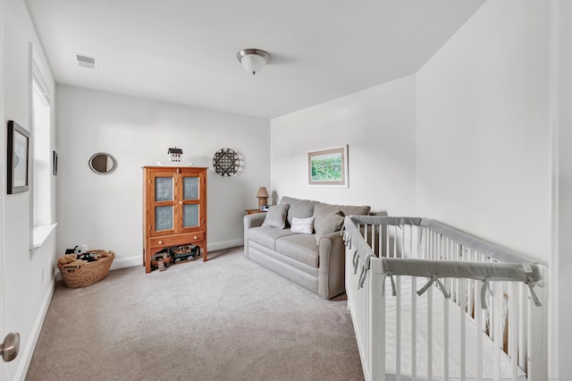 carpeted living room with baseboards and visible vents