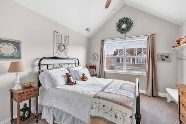 carpeted bedroom featuring visible vents, baseboards, vaulted ceiling, and a ceiling fan