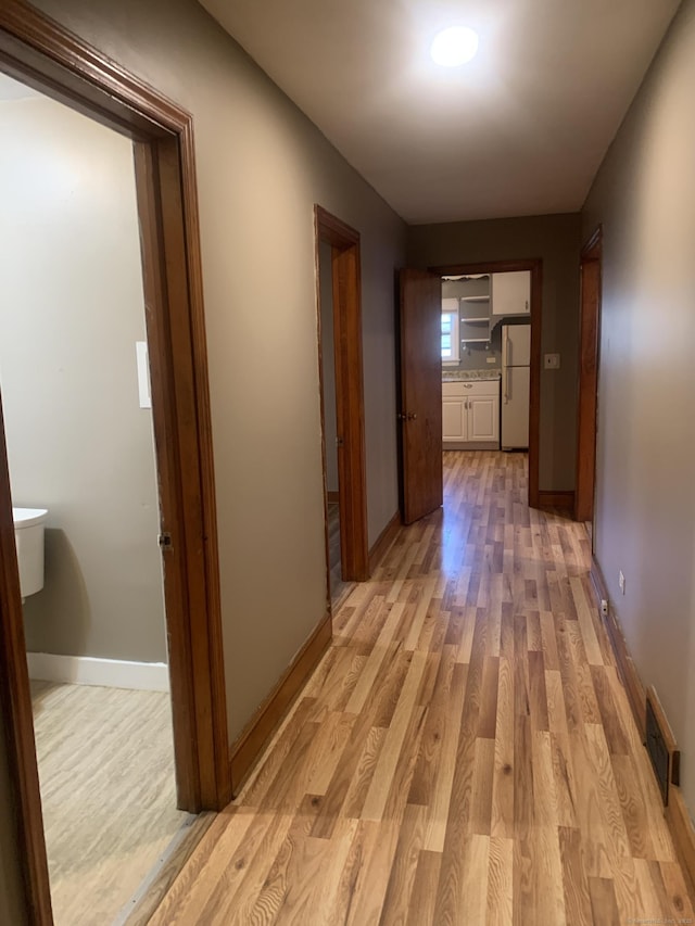 hallway featuring light hardwood / wood-style floors