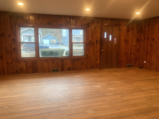 unfurnished room with light hardwood / wood-style flooring