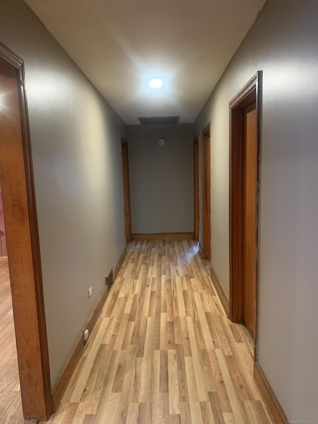 hallway featuring light wood-type flooring