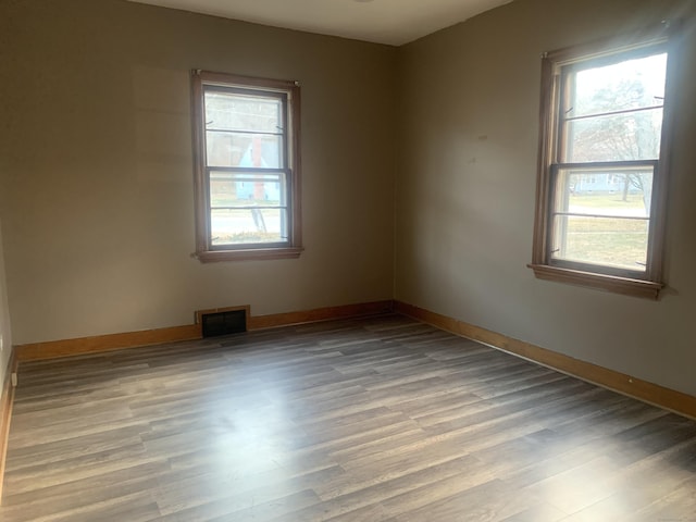 unfurnished room featuring wood-type flooring