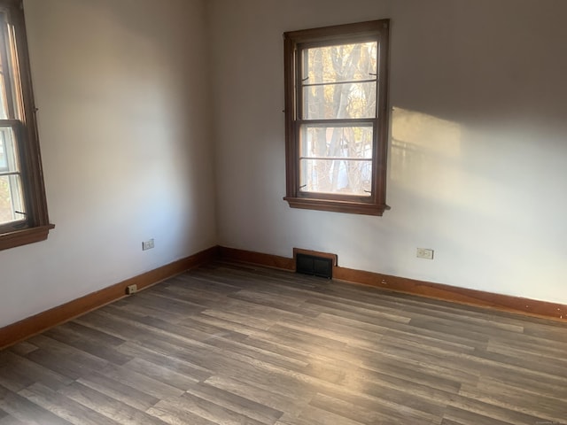 spare room featuring hardwood / wood-style floors