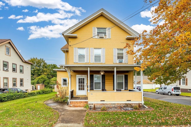 front of property with a front lawn and a porch