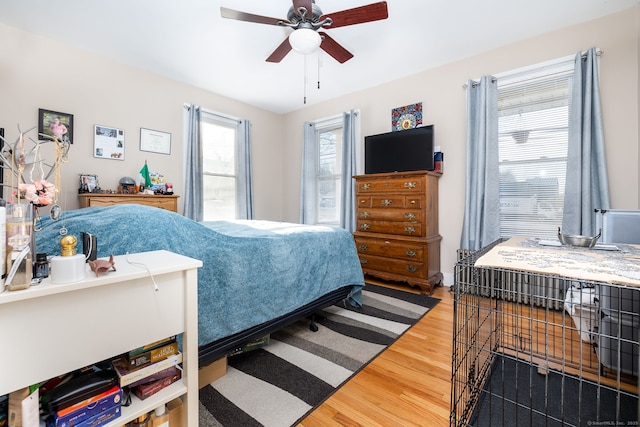 bedroom featuring ceiling fan and hardwood / wood-style flooring