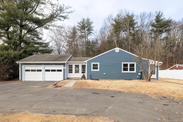 ranch-style home with a garage