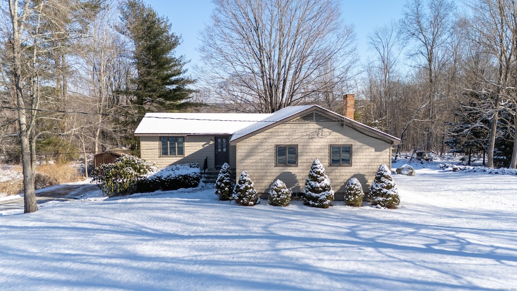 view of snow covered property