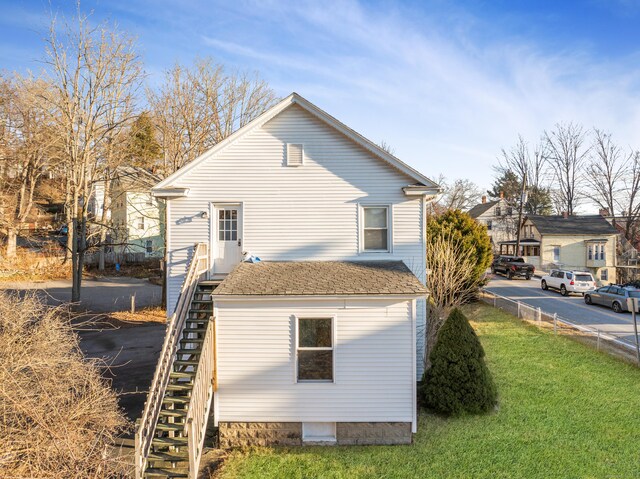 view of home's exterior with a yard