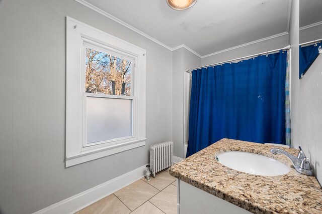 bathroom with radiator heating unit, ornamental molding, vanity, and tile patterned flooring