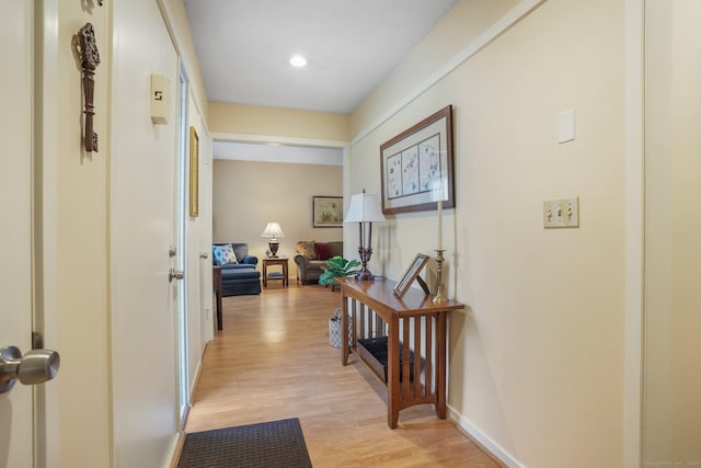 hall with light hardwood / wood-style flooring