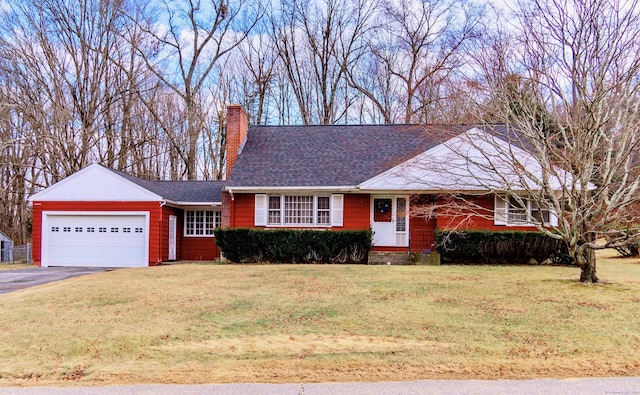 single story home with a front lawn and a garage