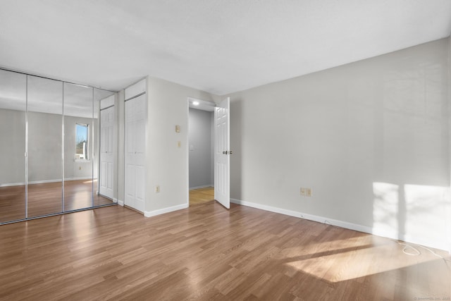 unfurnished bedroom with light hardwood / wood-style floors