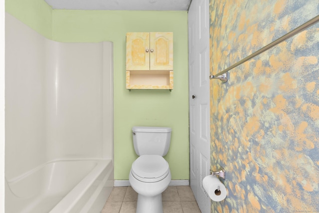 bathroom with toilet and tile patterned flooring