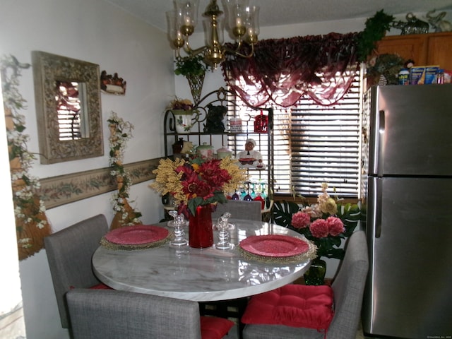 dining area featuring a notable chandelier