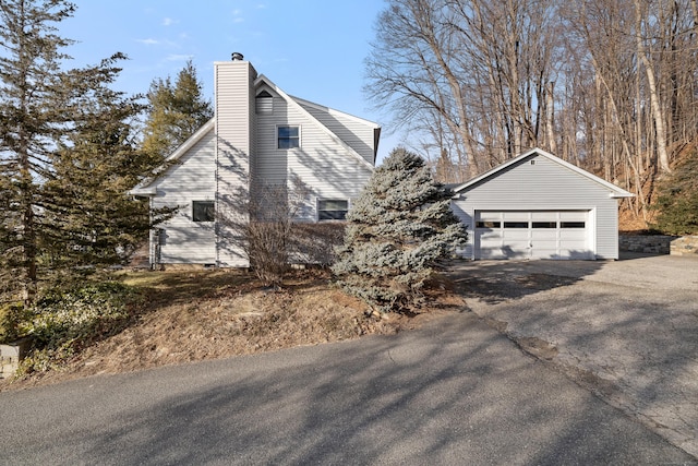 view of property exterior featuring a garage