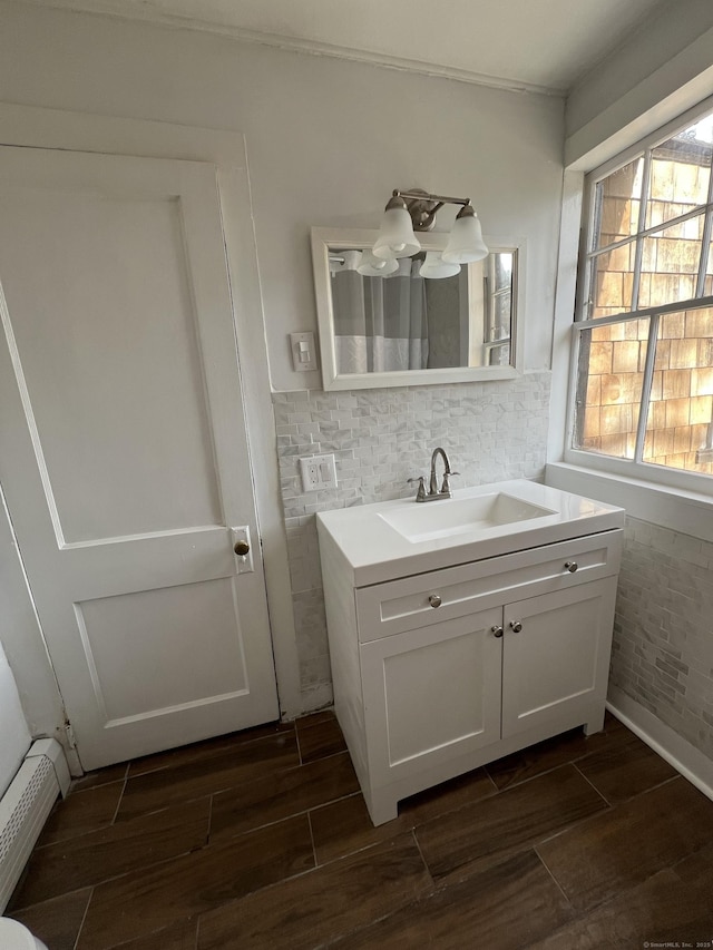 bathroom with vanity and a baseboard radiator