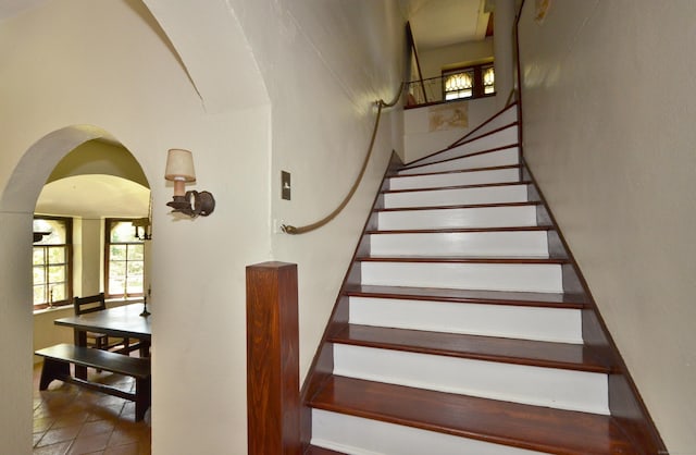 staircase with arched walkways