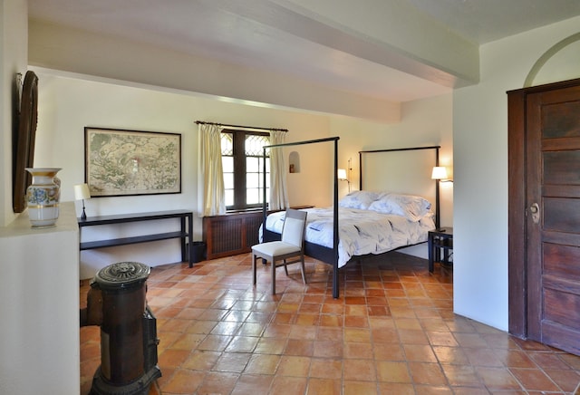 bedroom featuring beamed ceiling