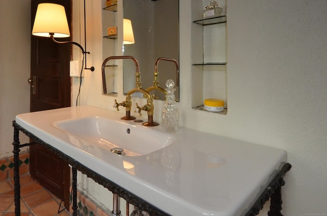 bathroom with a sink and tile patterned floors