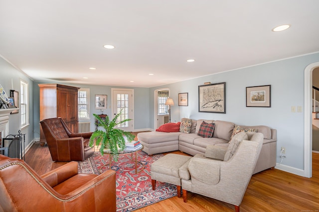 living room featuring hardwood / wood-style floors and ornamental molding