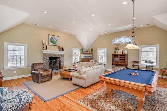 rec room with a healthy amount of sunlight, a fireplace, light hardwood / wood-style floors, and billiards