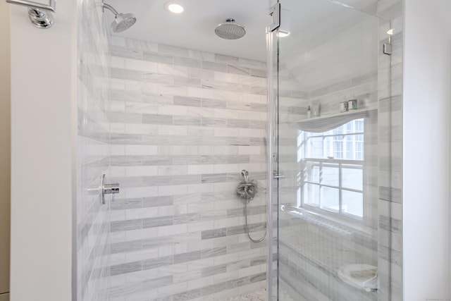 bathroom featuring an enclosed shower and vaulted ceiling