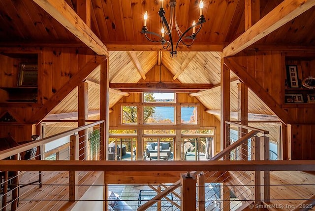 interior details with an inviting chandelier, wood ceiling, and beamed ceiling