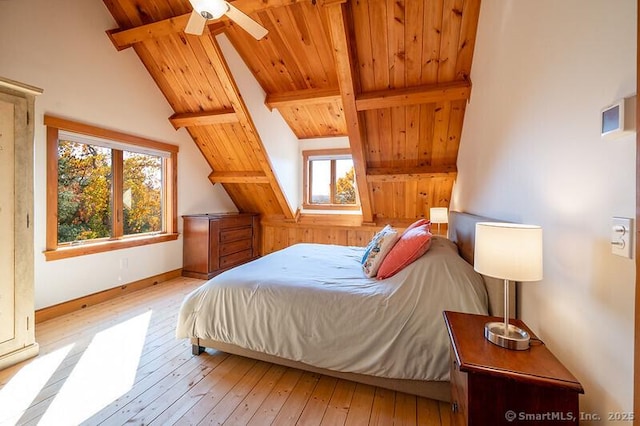 bedroom featuring wooden ceiling, light wood finished floors, lofted ceiling with beams, and baseboards