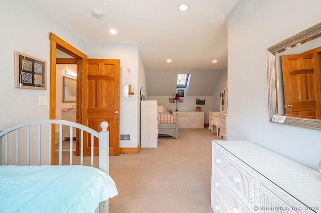 carpeted bedroom featuring a skylight