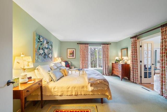 bedroom with carpet flooring and french doors