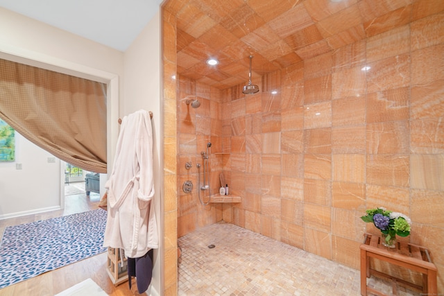 bathroom featuring a tile shower