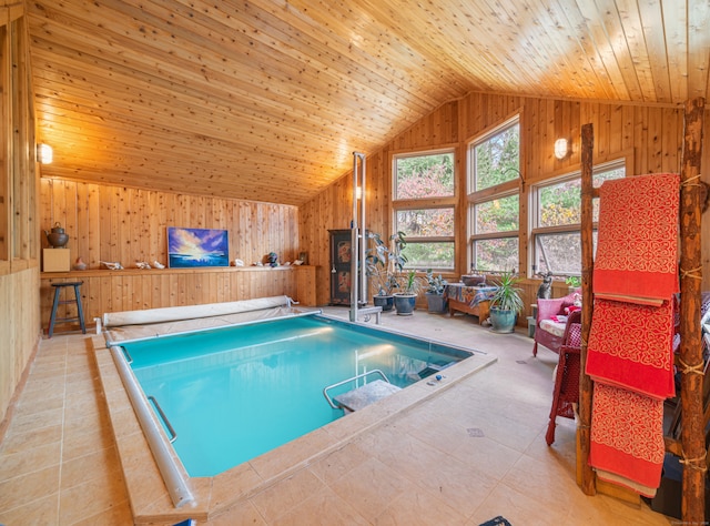 view of swimming pool featuring an indoor hot tub