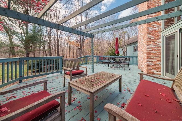 wooden deck featuring a pergola