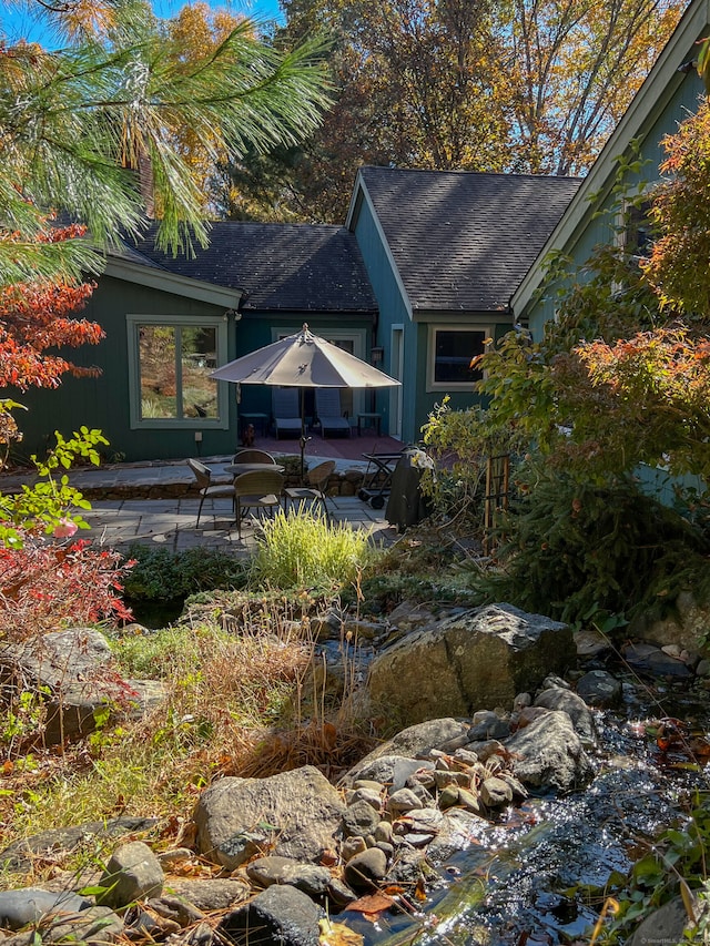 back of property featuring a patio area