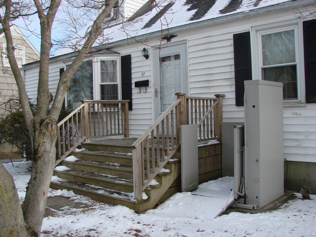 view of snow covered property entrance