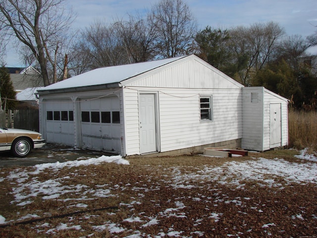 view of snow covered garage